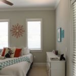White custom shutters for a bedroom by Hunter Douglas from Williams Window Treatments.